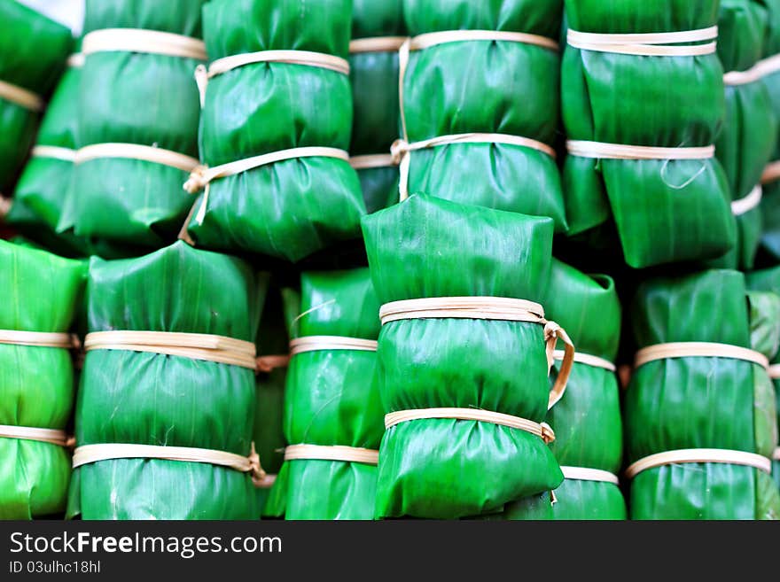 Thai sticky rice dessert wrapped in a leaf Banana