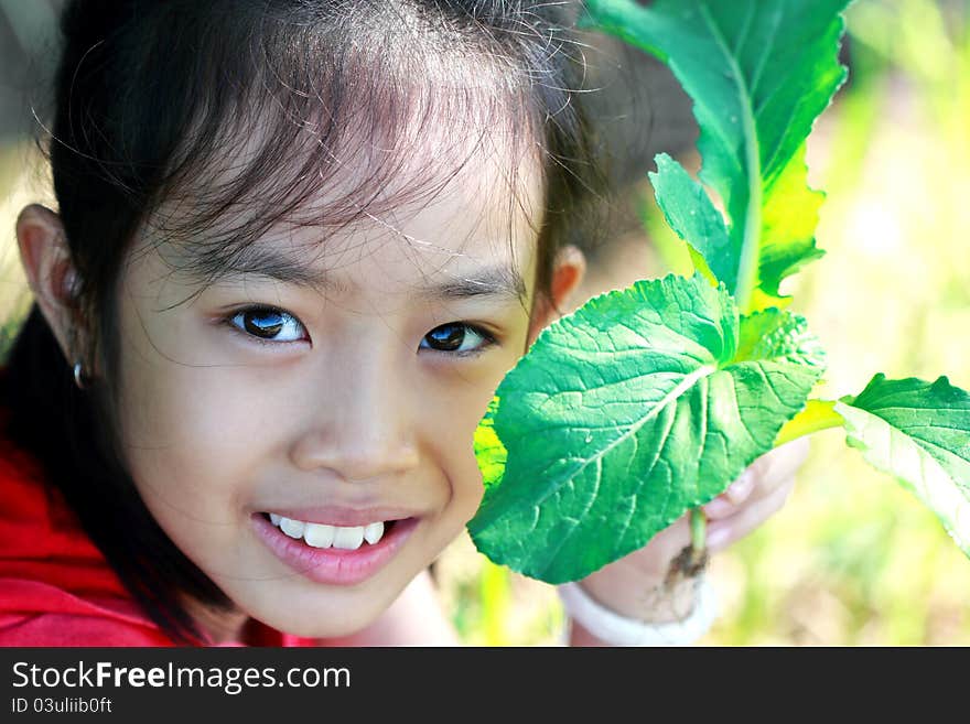 Girls and vegetables grown in the field. Girls and vegetables grown in the field