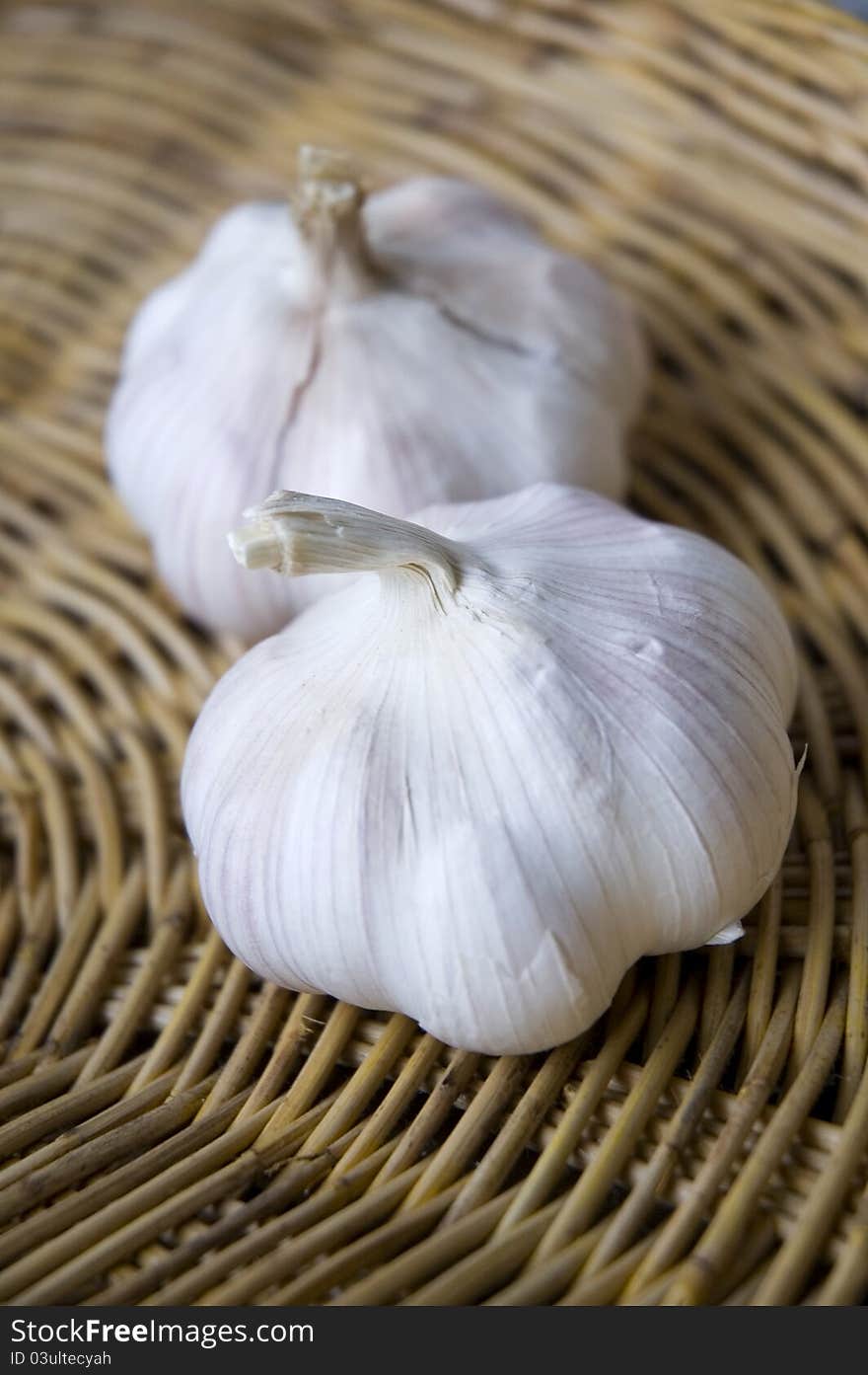 Two of organic garlics on basket