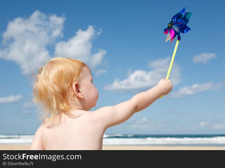 Child of the sea with spinner in the hands of