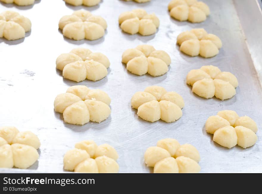 A cookie tray with homemade cookies for baking