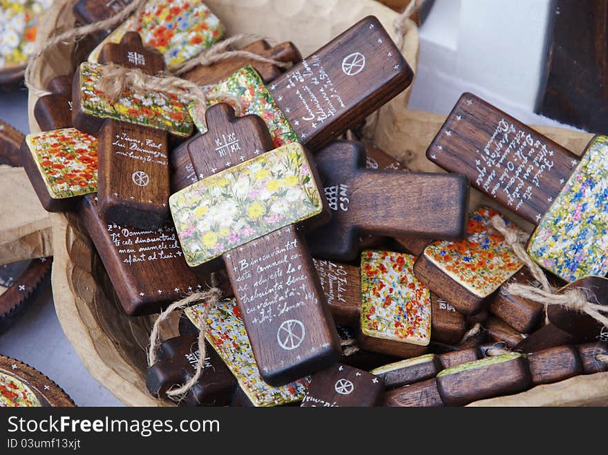 Wooden painted crossess in a basket