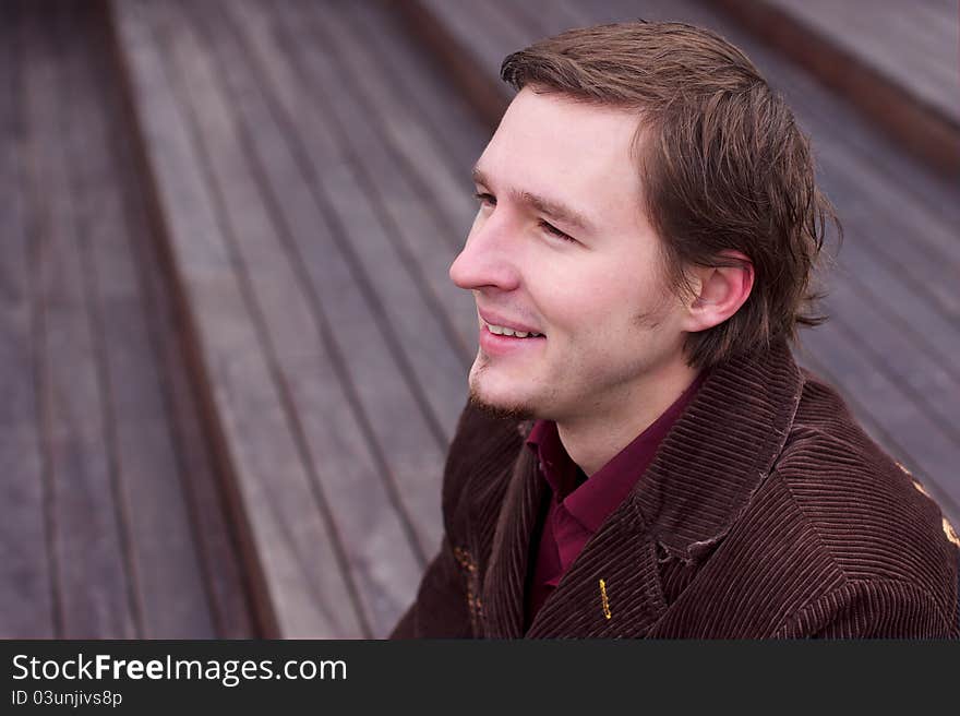 Young Man Smiling And Looking Down Stairs