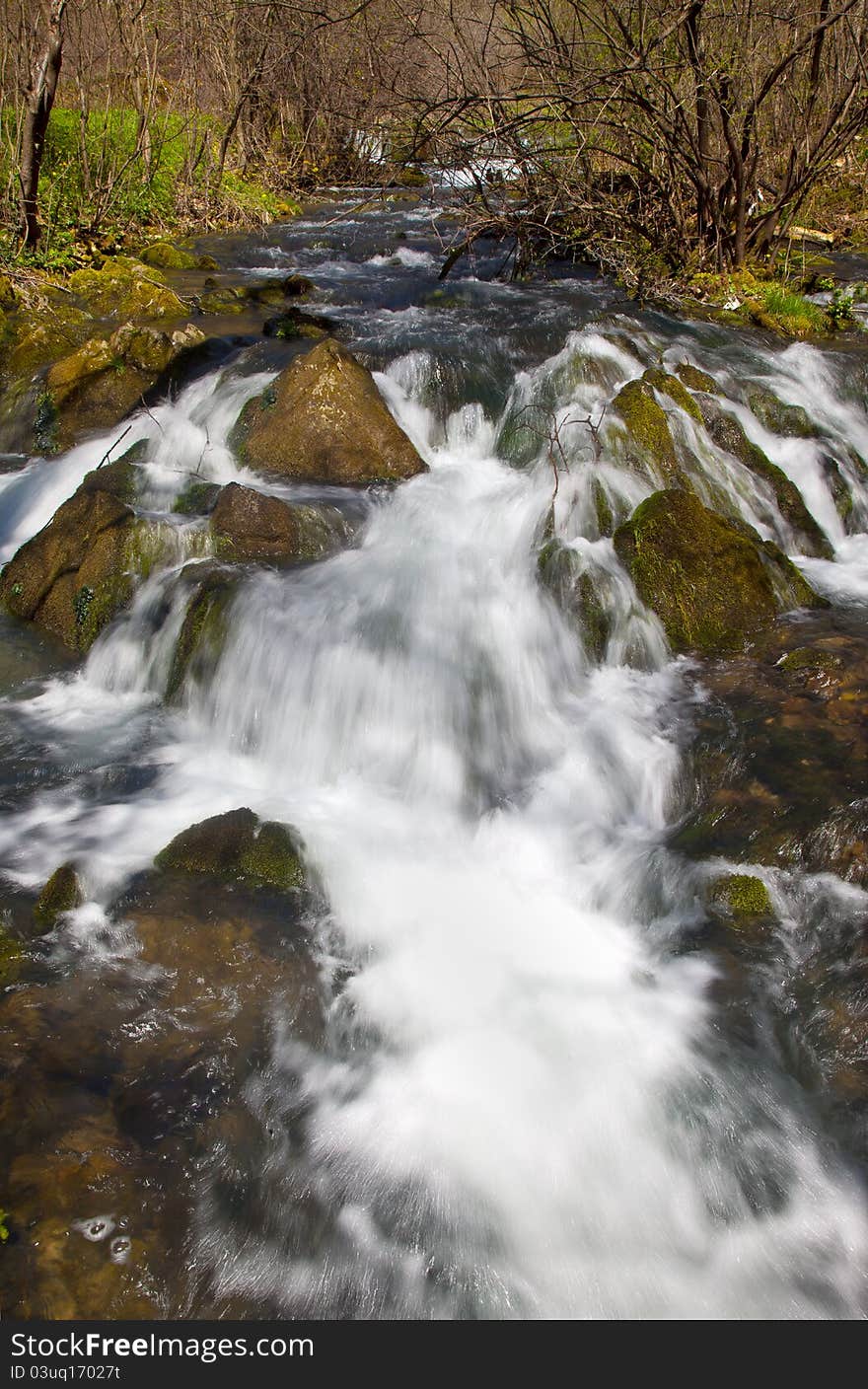 River rapids in the forest in spring time. River rapids in the forest in spring time