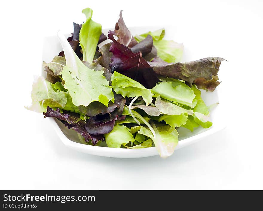 Salad from fresh leaves of korn, rucola and mangold (red chard). Salad from fresh leaves of korn, rucola and mangold (red chard)