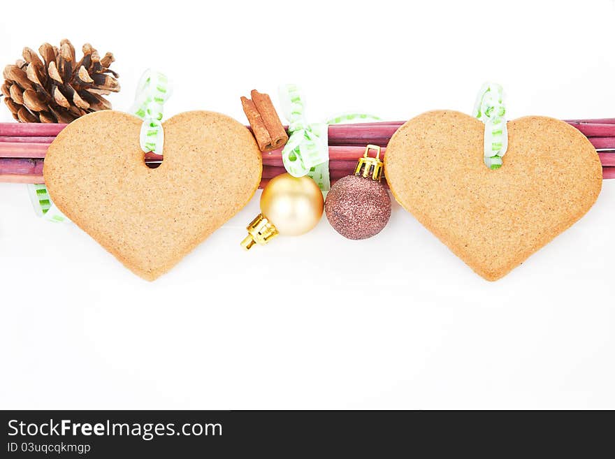 Christmas still life with heart shaped gingerbread, cinnamon, pine cone and copy space. Temporary christmas concept. Christmas still life with heart shaped gingerbread, cinnamon, pine cone and copy space. Temporary christmas concept.