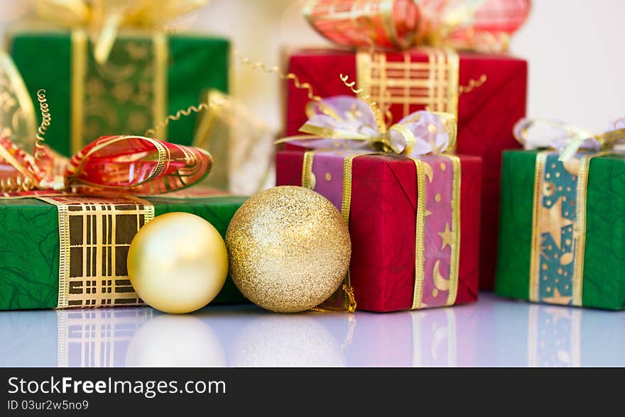 Red and green Christmas gifts with Christmas balls