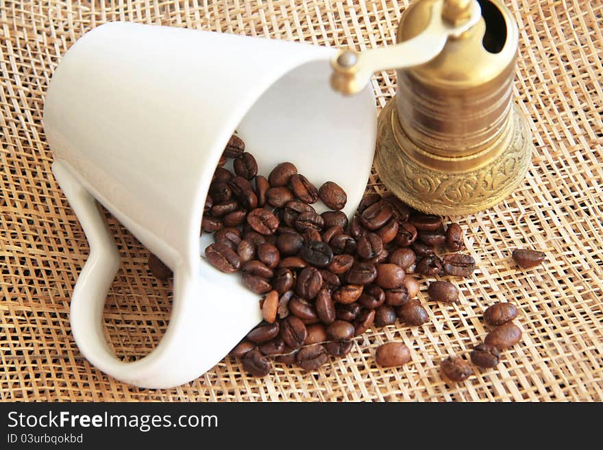 White cup with coffee beans