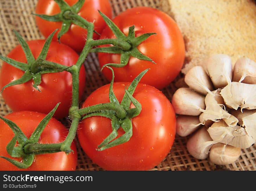 Tomatoes with garlic and bread. Tomatoes with garlic and bread