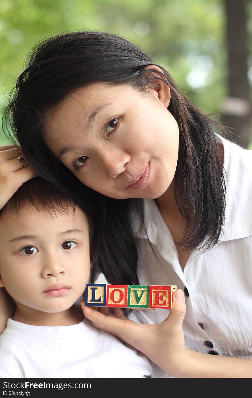 Mother love son held the letters LOVE