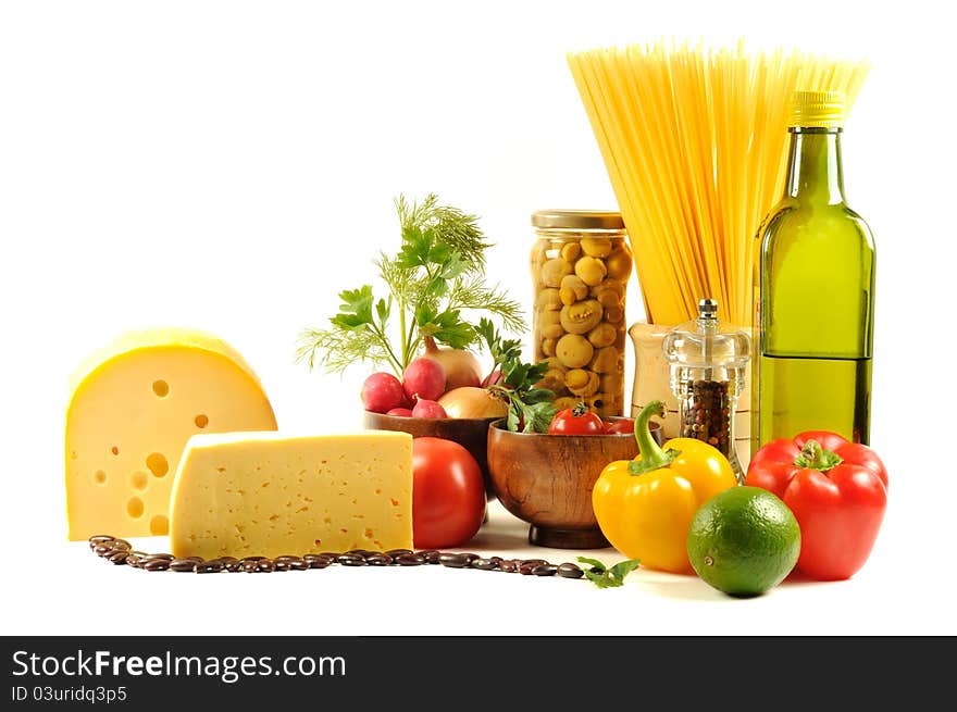 Vegetables , pasta, cheese and different spice,  on a white background. Vegetables , pasta, cheese and different spice,  on a white background