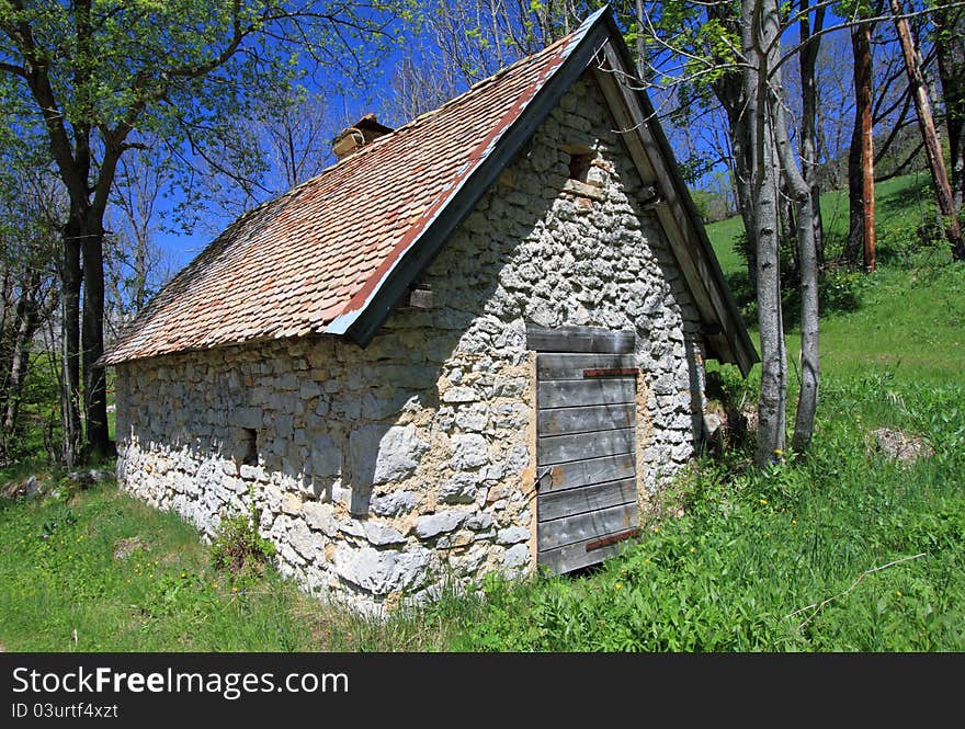 Small restored shepherd farmhouse in natural park by a sunny day. Small restored shepherd farmhouse in natural park by a sunny day