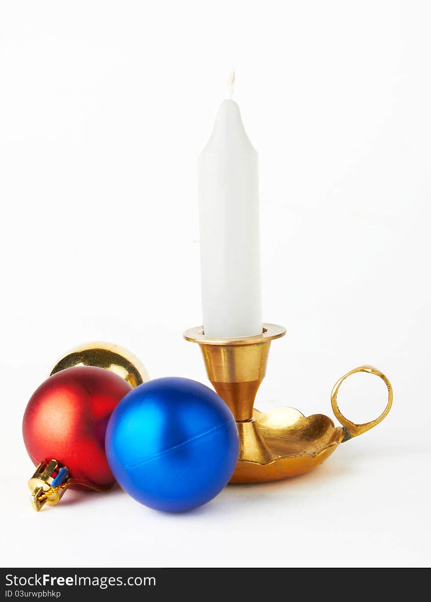 Christmas and New Year decoration- balls and candle .On white background