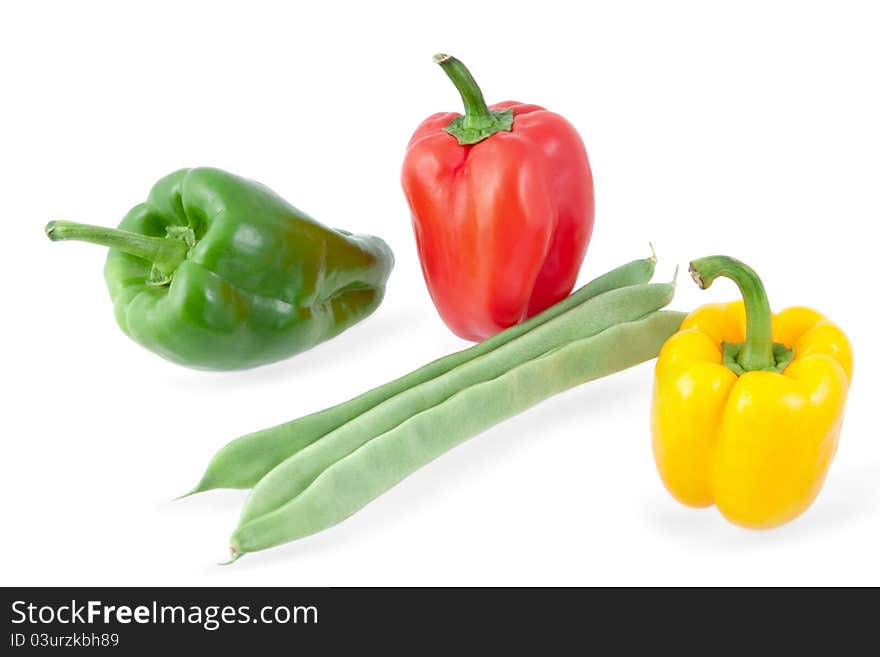 Green beans with yellow, green and red peppers on a white background. Green beans with yellow, green and red peppers on a white background