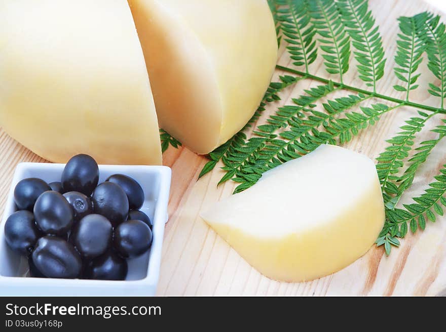 Species Of Cheeses On A Wooden Board