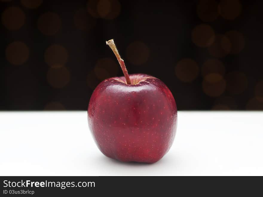 Single red heirloom apple with black and white. Single red heirloom apple with black and white