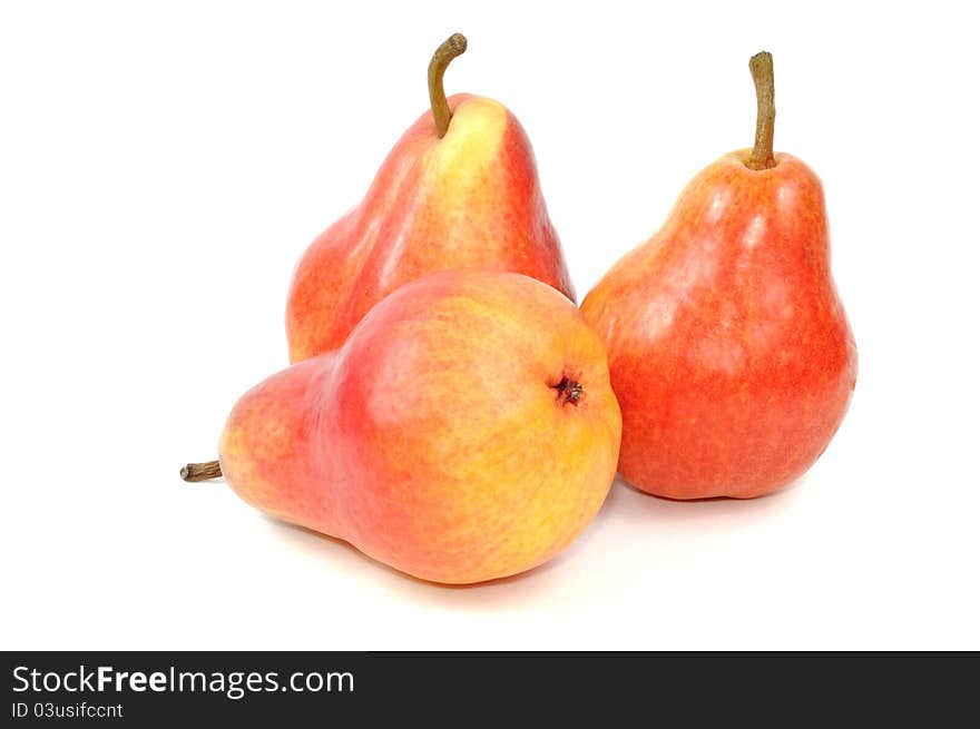 Fresh red pears on a white background, close up. Fresh red pears on a white background, close up