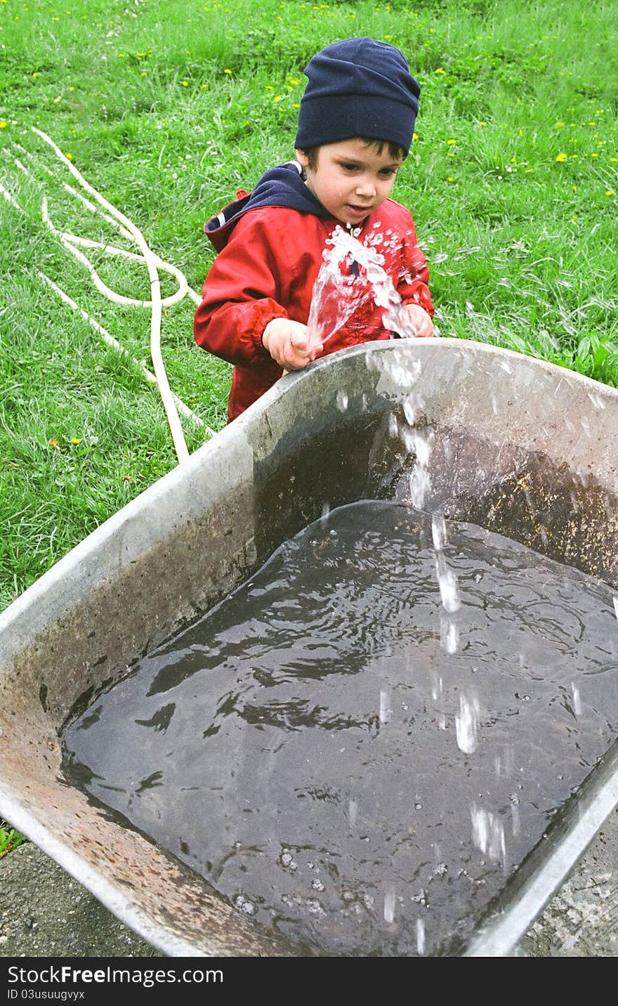 Boy Playing With Water