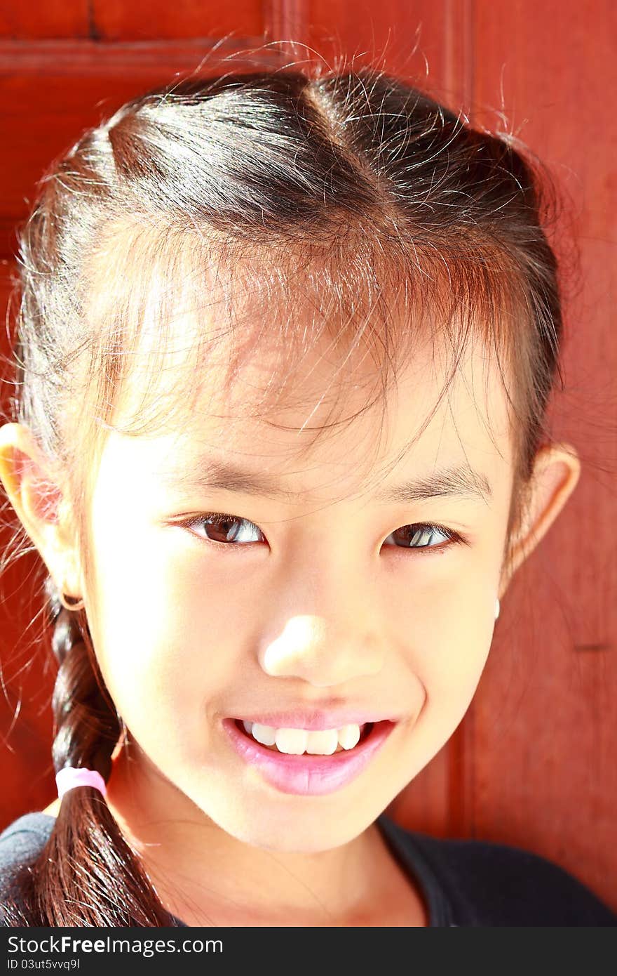 Little Girl Smiling And Cheerful