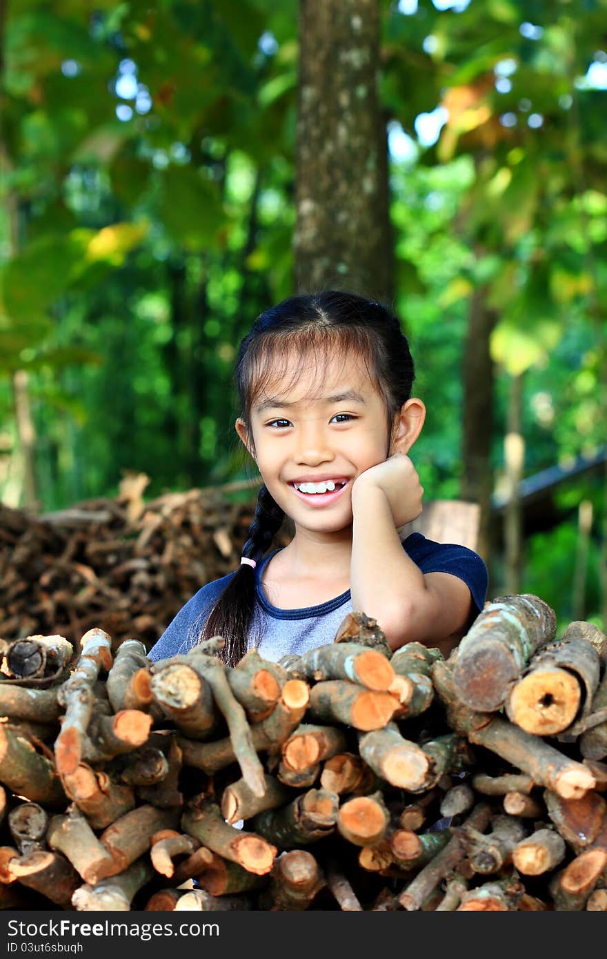 Little girl smiling rosy in the garden. Little girl smiling rosy in the garden