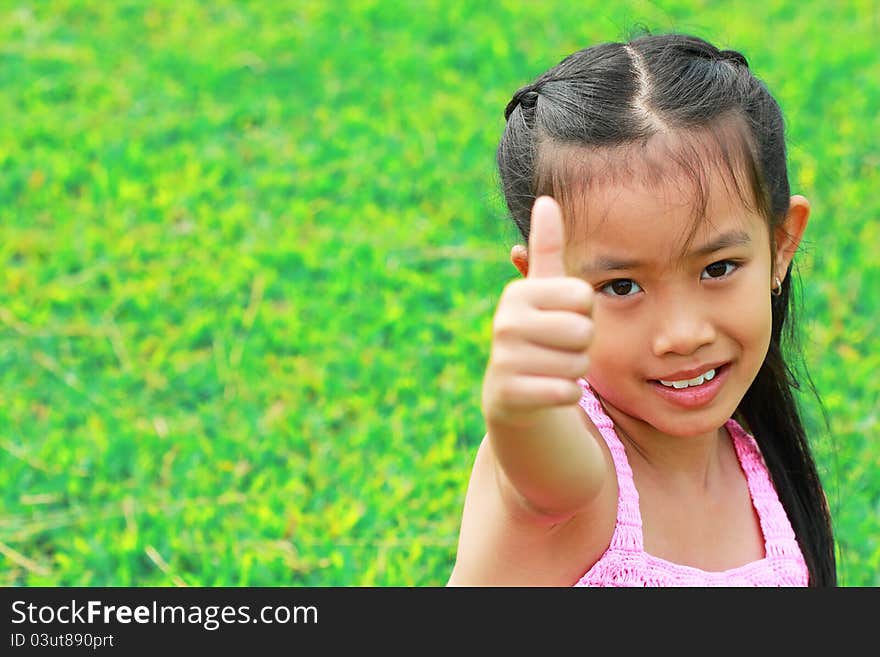 Little girl sitting and posting pictures