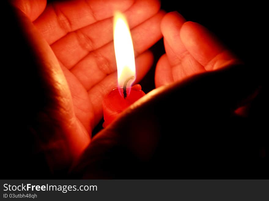 Candle in the hands of women. Candle in the hands of women