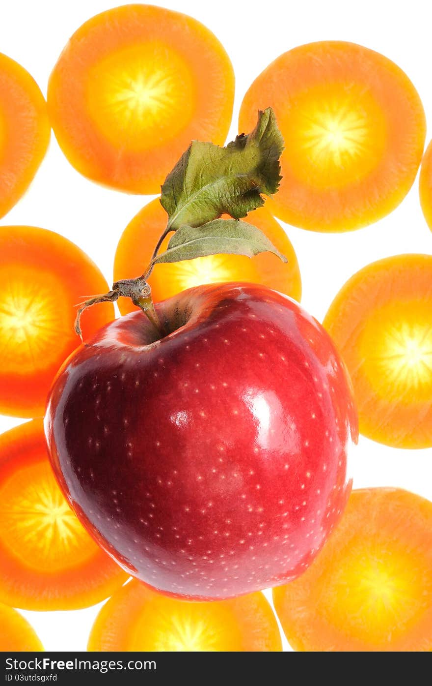 Shiny red apple on carrot background