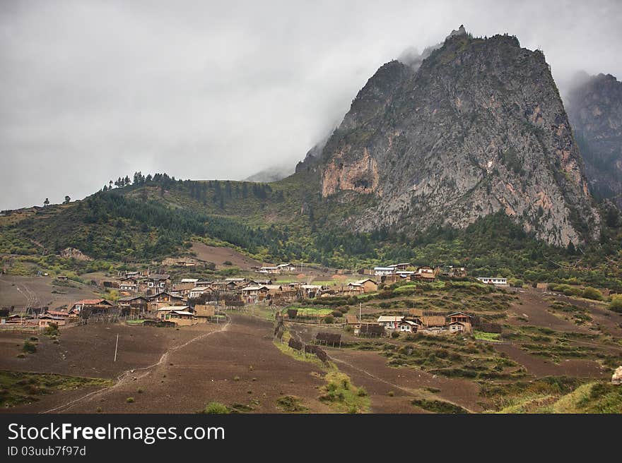 Mountain and village in cloud day