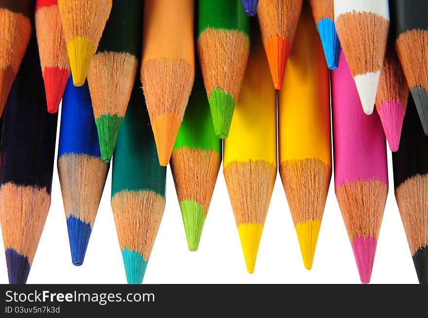 Arranged color pencils over white. Arranged color pencils over white.