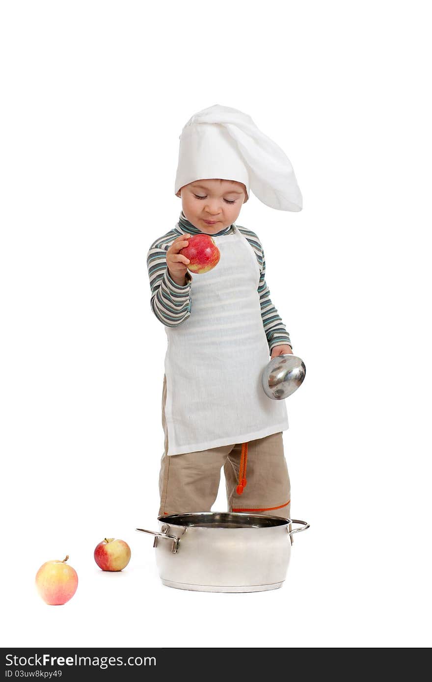 Kitchen boy with apples and pan on white