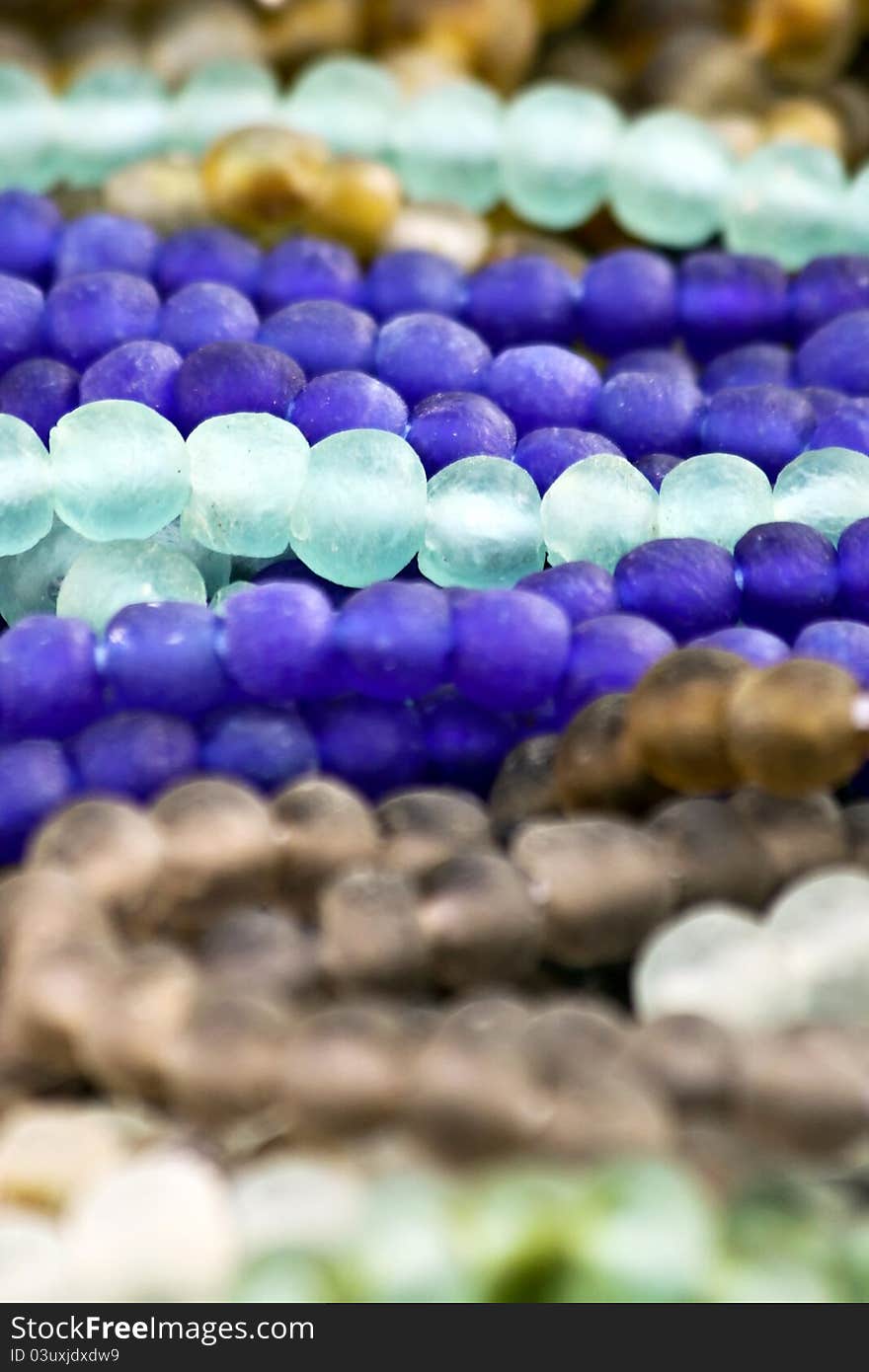 Glass beads in various shades of blue and brown. Glass beads in various shades of blue and brown