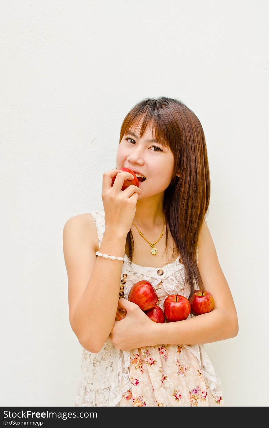 Asain Girl Eating Apple On White Background