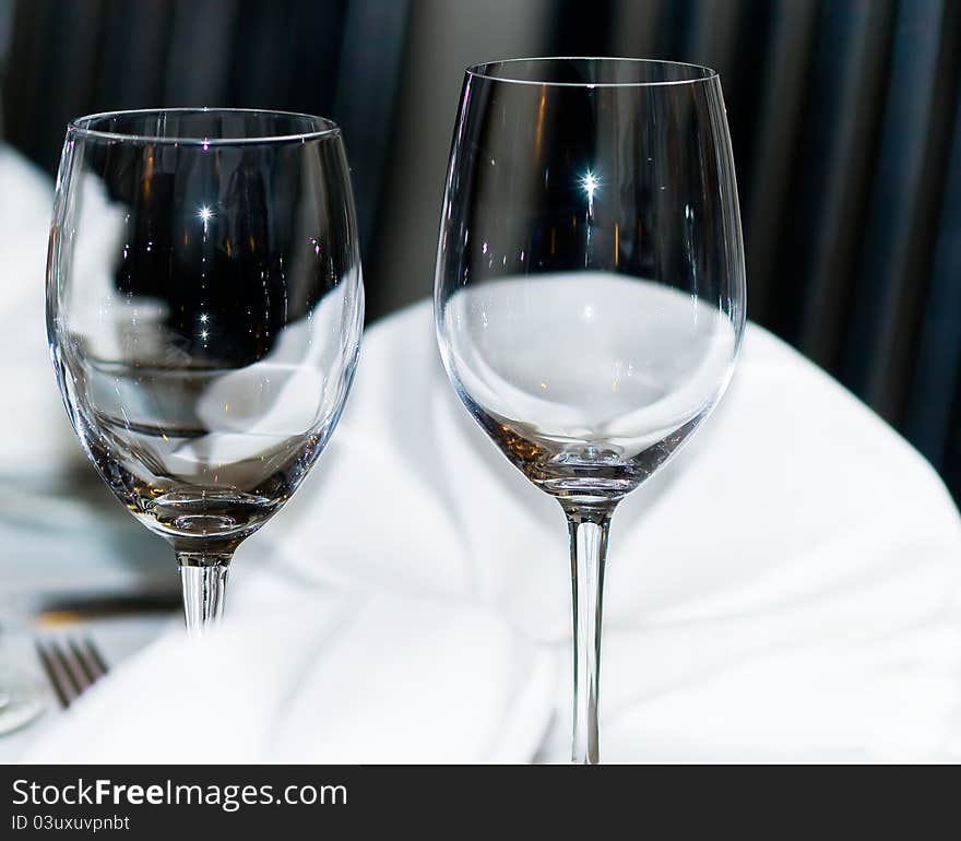 Elegant wine glasses are in a restaurant