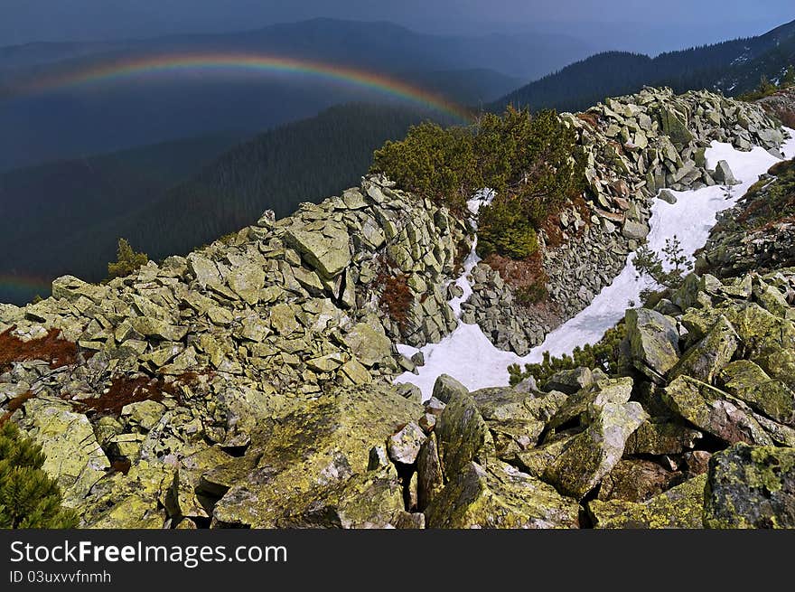 Rainbow high in the mountains after the rain