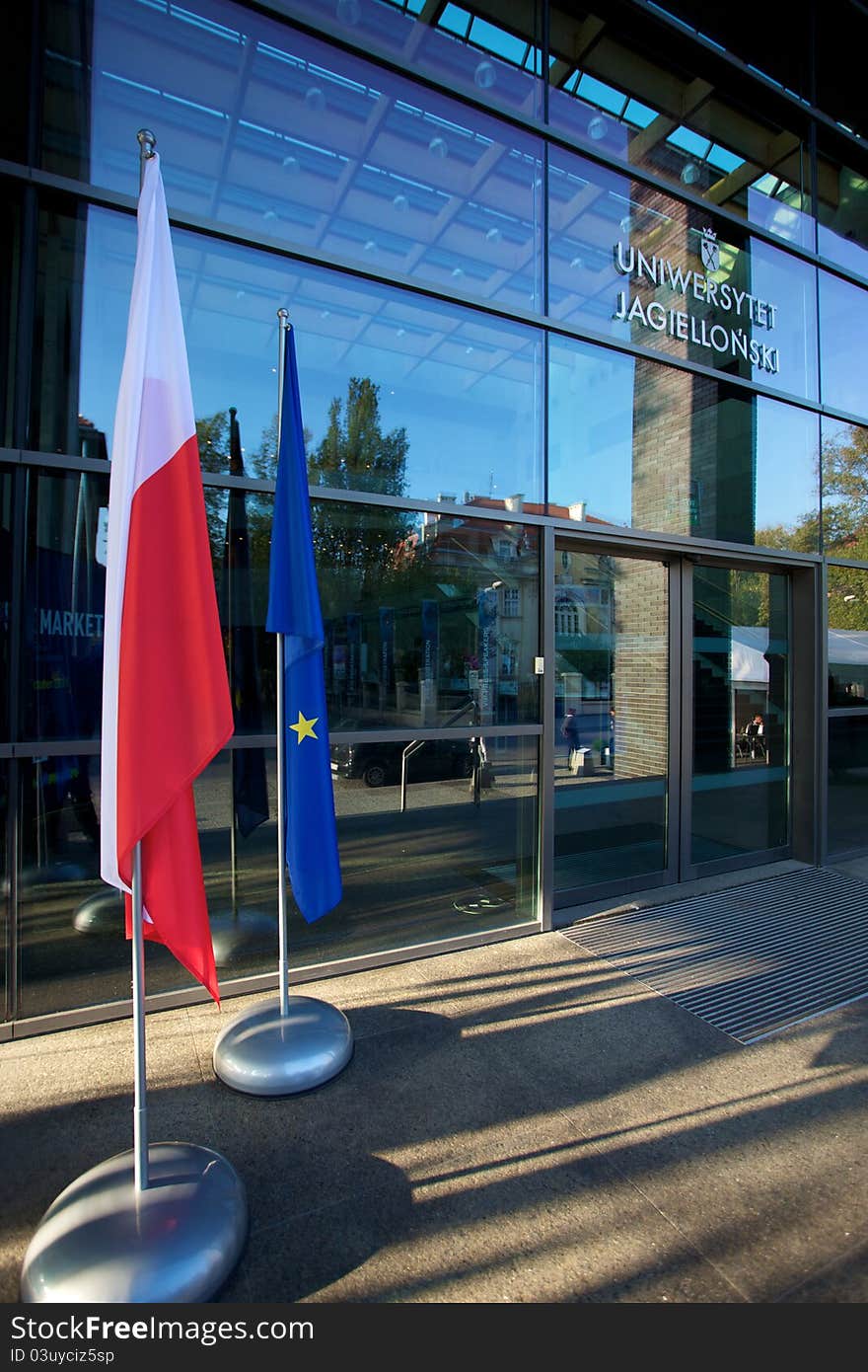 Europe and Polish Flags floating in a European conference about the global market in Poland with windows in the background