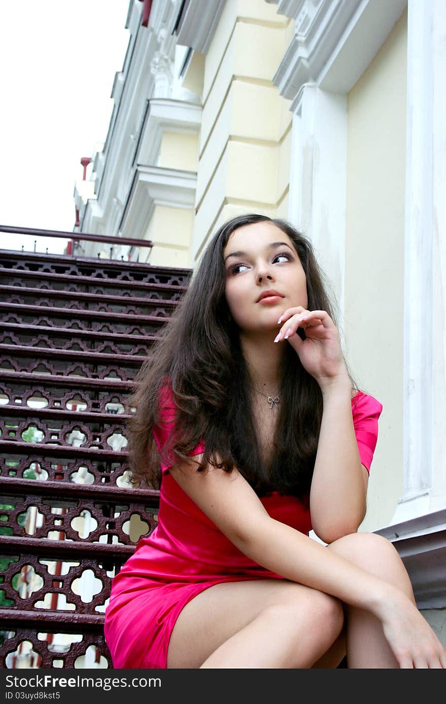 Young caucasian woman near the theatre