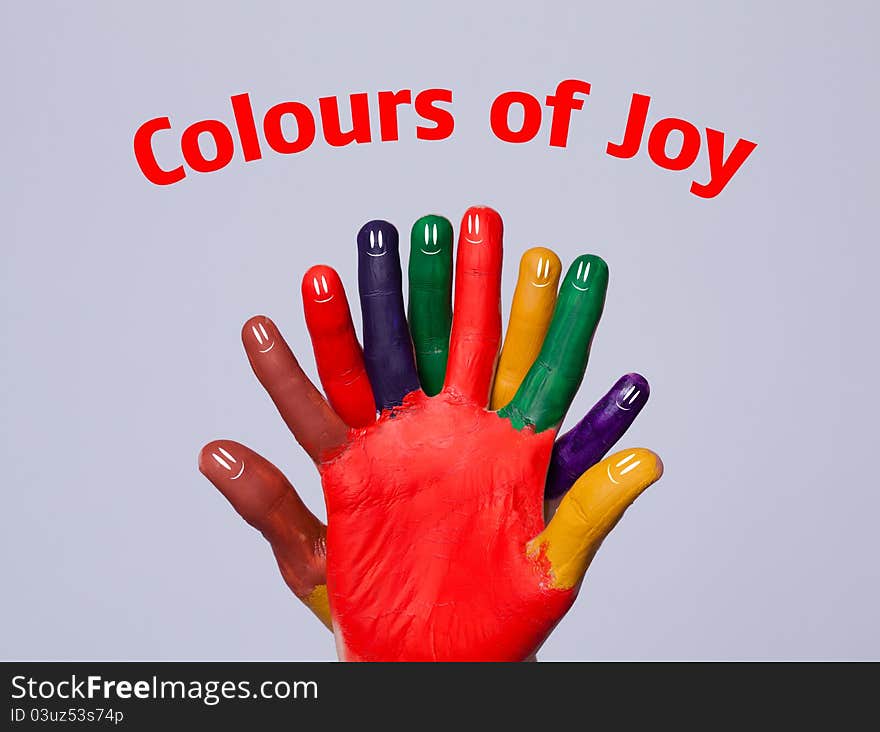 Happy finger smileys with colours of joy sign