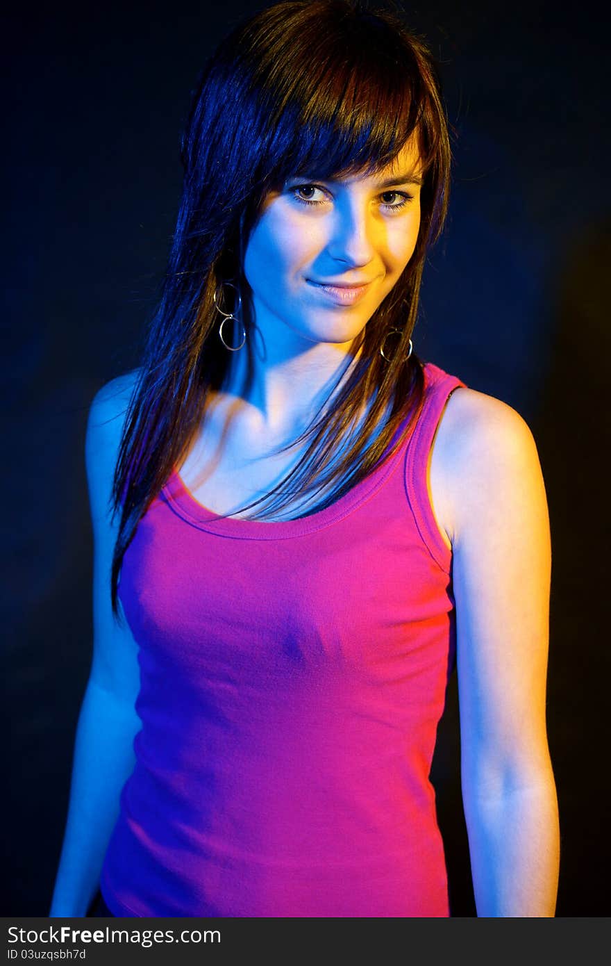 Portrait of pretty girl at disco on black background. Portrait of pretty girl at disco on black background.