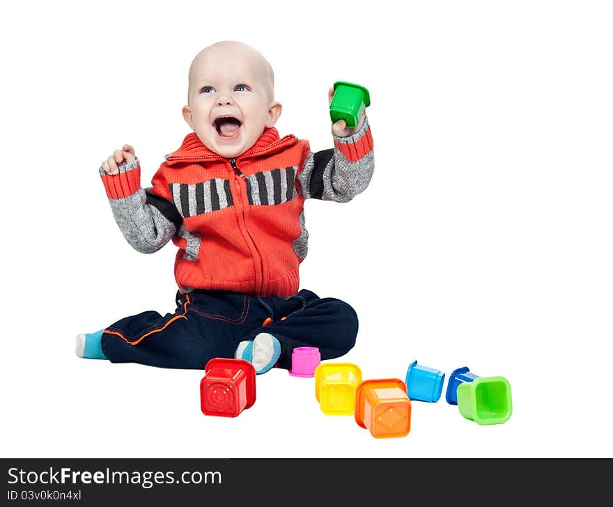 Little boy with a plastic pyramid in the studio on a white background