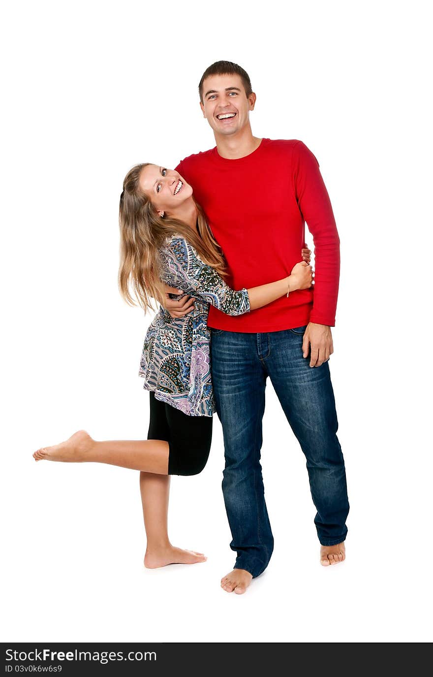 Loving couple embracing in studio on white background