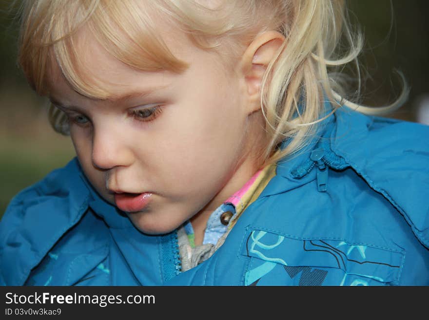 A child watching in amazemant at something. A child watching in amazemant at something