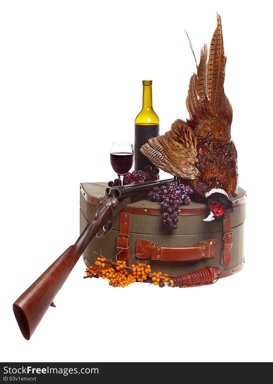 Pheasant, suitcase, shotgun on the white backgroun