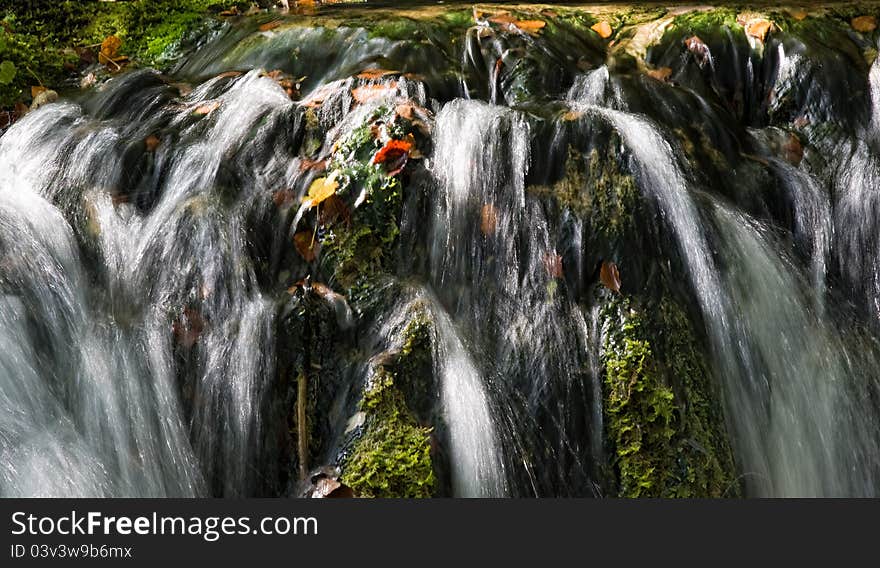 Waterfall in the forest at Plitvicka Jezera - Plitvice. Waterfall in the forest at Plitvicka Jezera - Plitvice