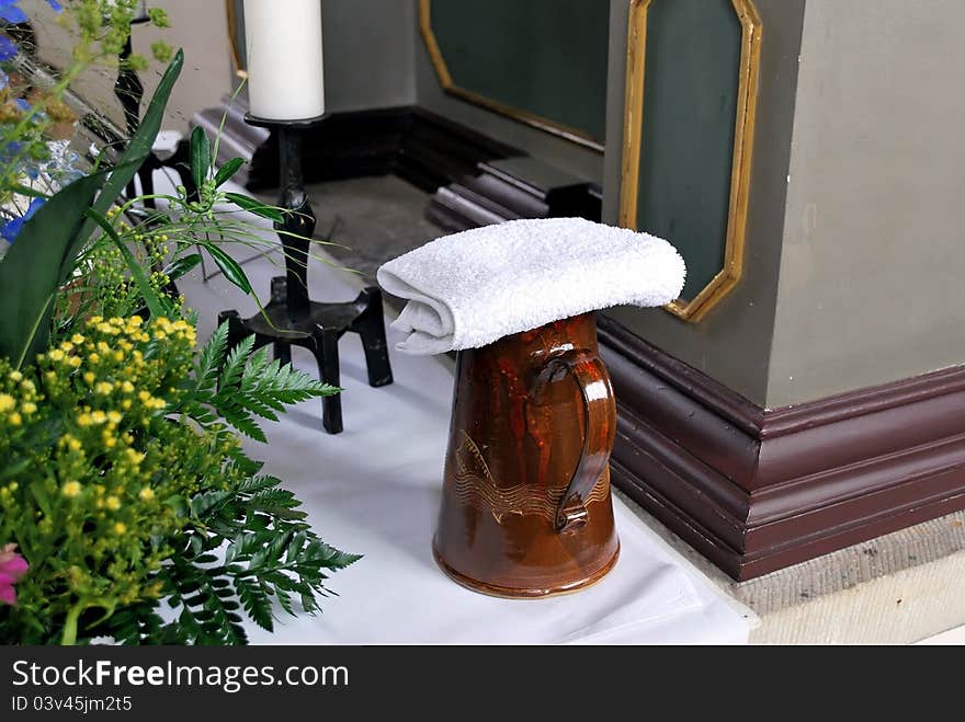 A baptism scene with holy water in a church