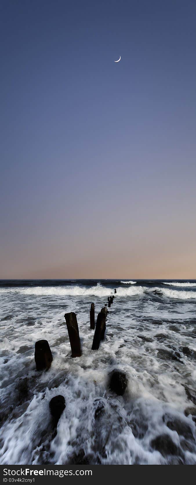 Moonrise over surf