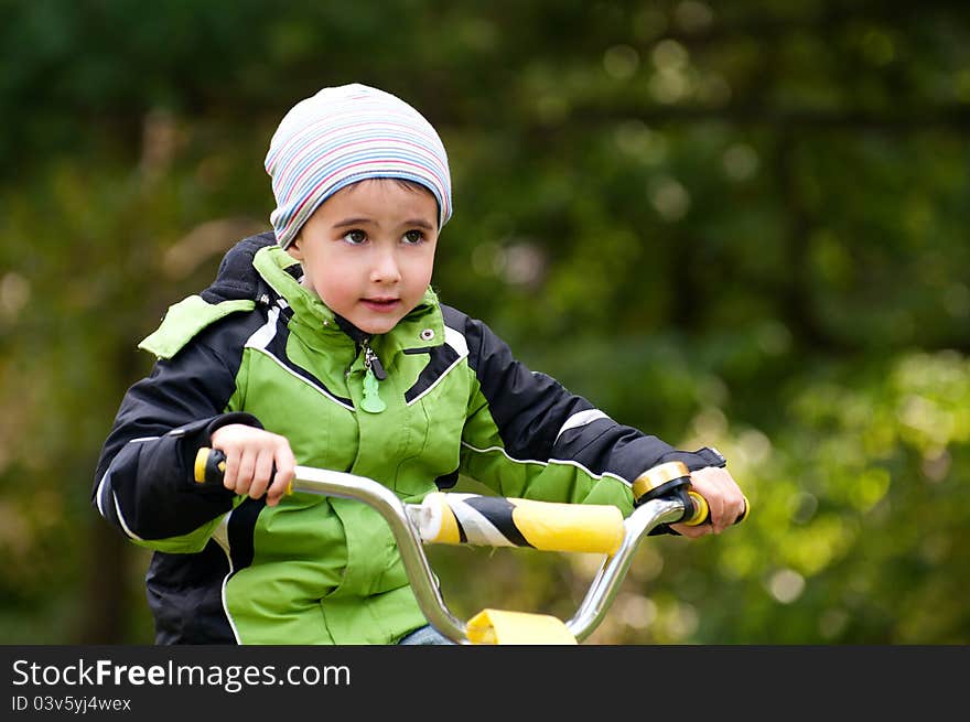 Little boy riding bike outdoors