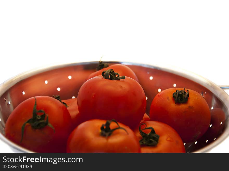 Tomatos in colander, ready for cooking