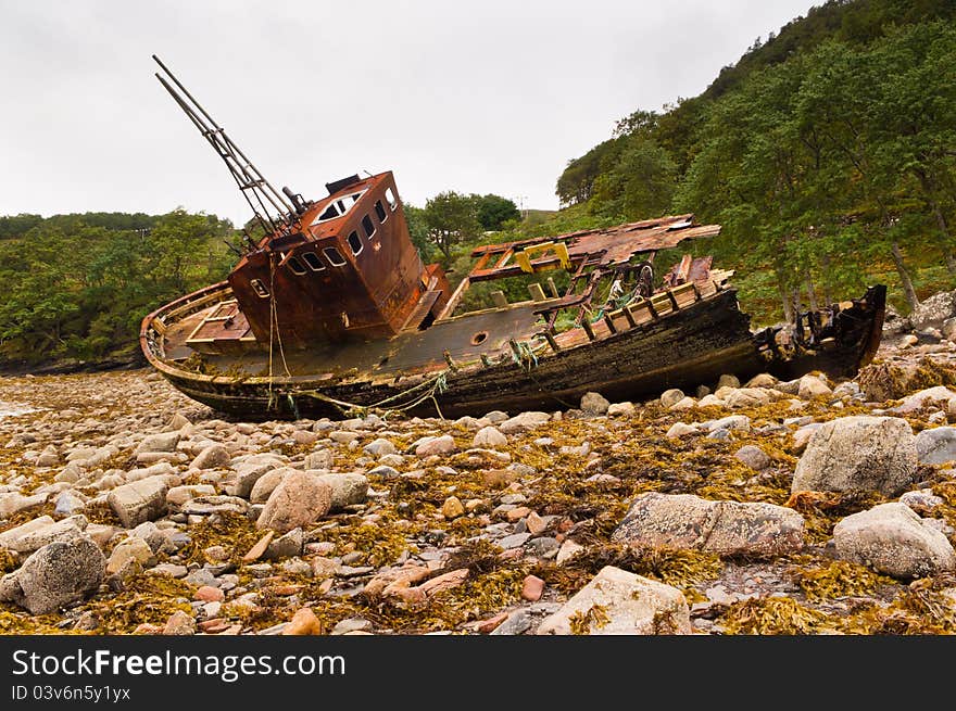 Wreck of fishing boat slowly falling into decay. Wreck of fishing boat slowly falling into decay