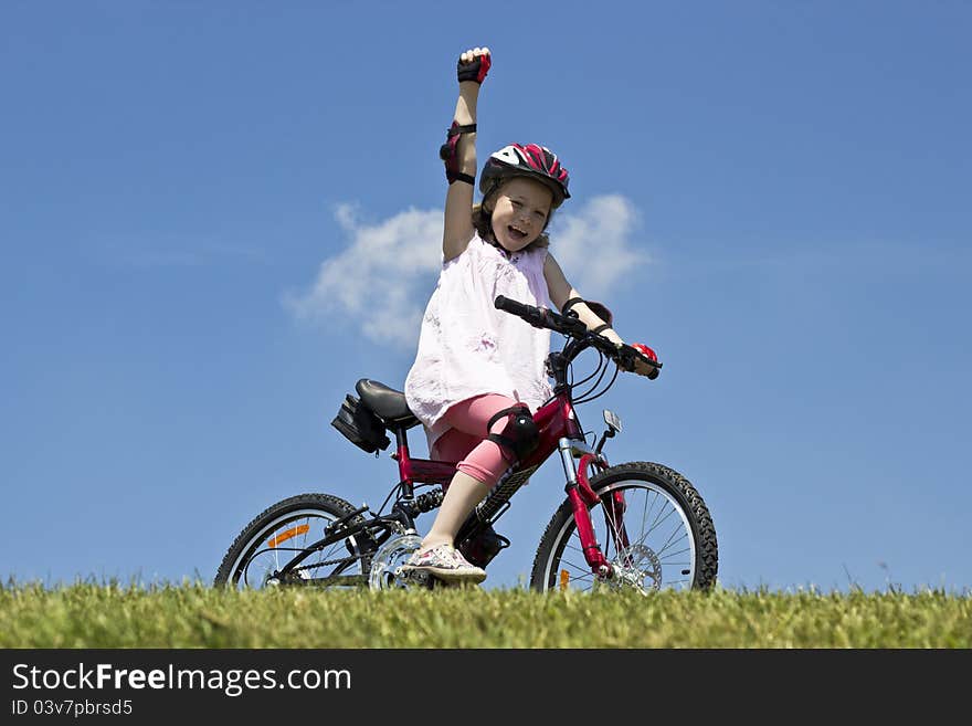 Young girl wins a bicycle race. Young girl wins a bicycle race