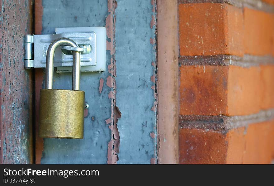 Door lock with red brick wall for security purpose. Door lock with red brick wall for security purpose.